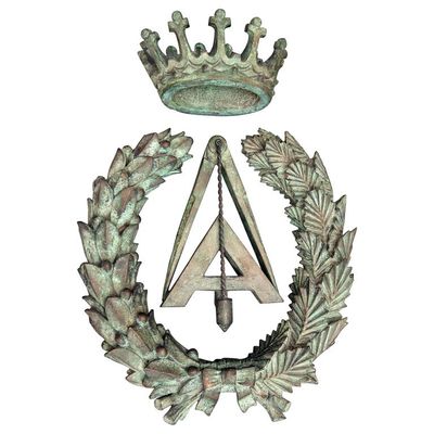 An unusual bronze wall decoration possibly Masonic or Mathematic symbols