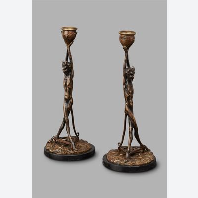 An unusual pair of Art Deco candlesticks featuring Satyrs