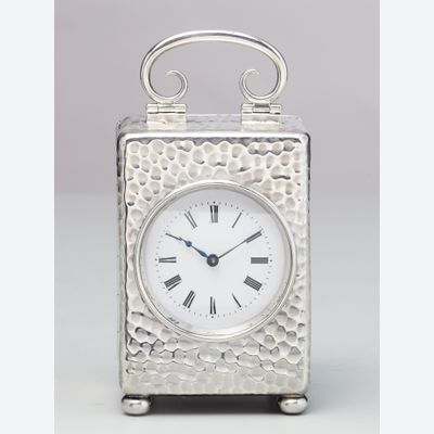A small English silver travelling clock by William Comyns, circa 1900