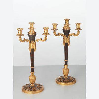 A rare pair of European four-light gilt bronze ‘Directoire’ candlesticks, circa 1810