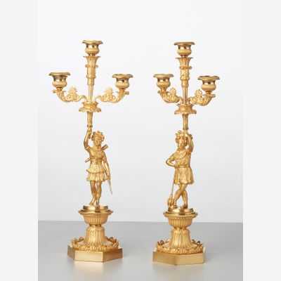 A pair of French bronze ‘Paul and Virginie’ candlesticks, circa 1830