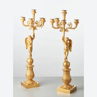 A pair of French bronze five-arm candlesticks with angels, circa 1830