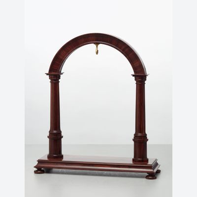 An elegant walnut contemporary custom made stand for displaying a watch