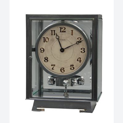 M127 Nickel five glasses ATMOS Clock champagne coloured  dial, Arabic numerals. On the back numbered 6972 and signature Brevet J.L. Reutter, S.G.D.G., made in Paris.