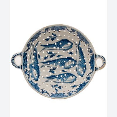 A Dutch Delft Blue and White Two-handled Tripod Circular Fish Strainer