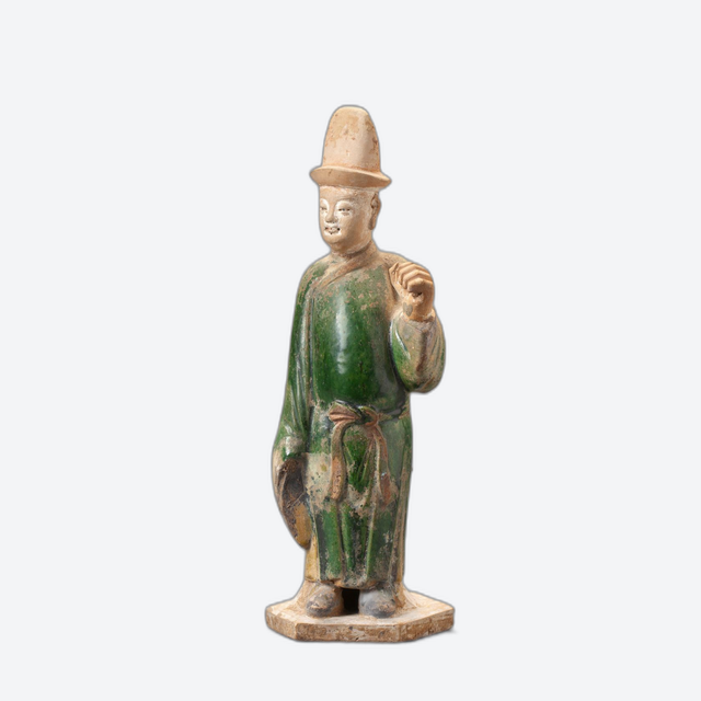 A Chinese green-glazed pottery figure of a tomb attendant