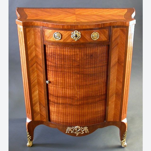 A kingwood and amaranth veneered commode