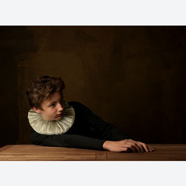 Boy with White Collar at Table