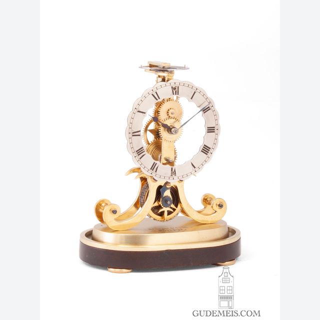 A miniature English brass skeleton clock, Fenton Bury, circa 1850.