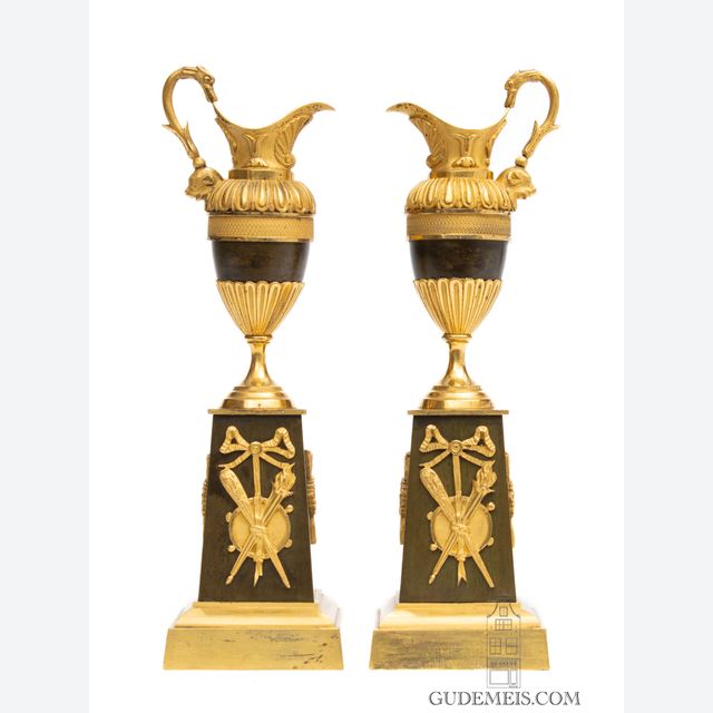 A pair of French Restoration gilt and bronze ewers/candle sticks, circa 1825