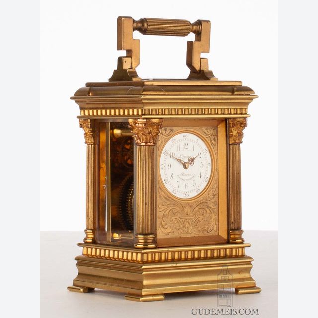 A small French glit brass travel clock by Lepine, circa 1900.