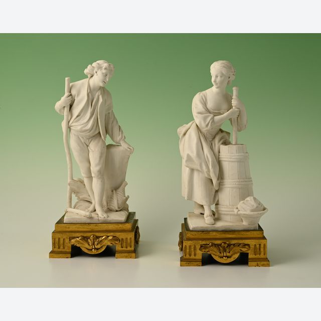 Een paar decoratieve biscuit-porseleinen beeldjes