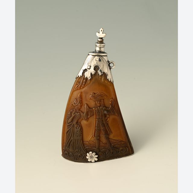 A 17th-century Dutch powder horn featuring an erotic scene.