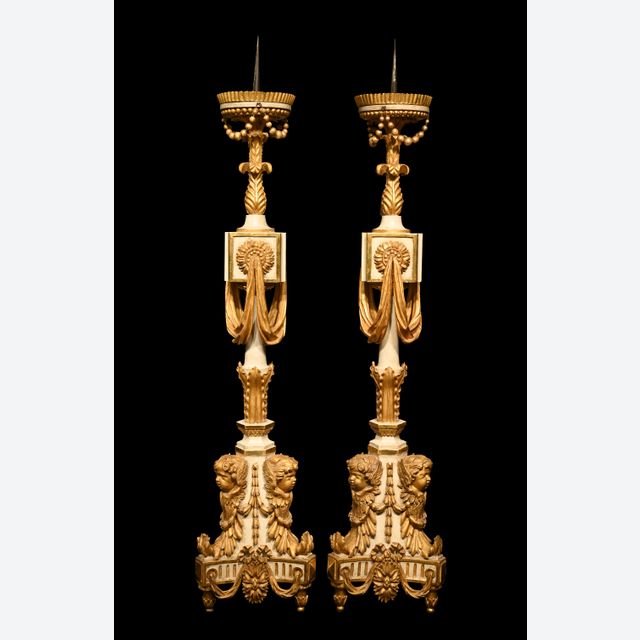 A rare pair of large torchères