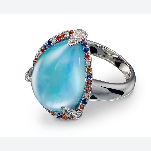 Ring with blue topaz diamonds and sapphire