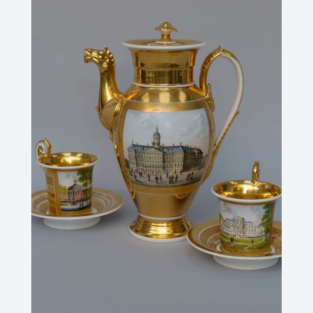 Empire coffee pot and two cups and saucers with views of Amsterdam, Haarlem and Rotterdam