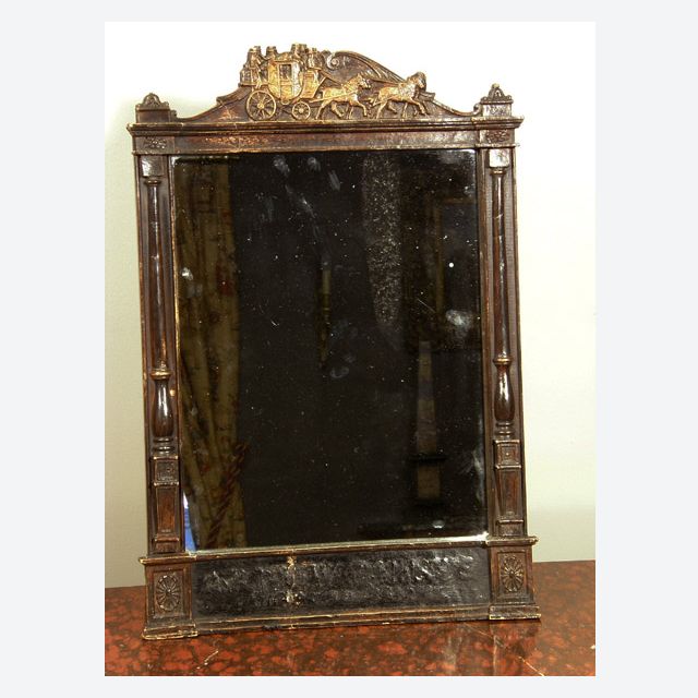 A mirror fitted in a former wooden time table frame, probably USA, ca 1880.