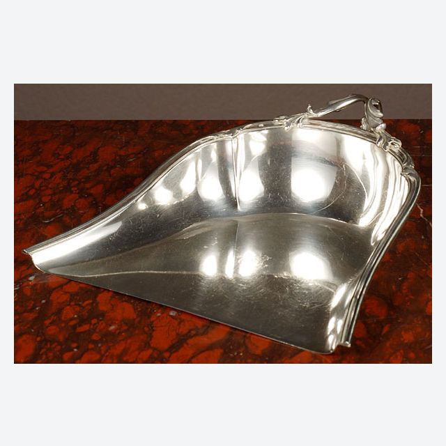 Silver dustpan with a beautifully decorated handle, circa 1880.