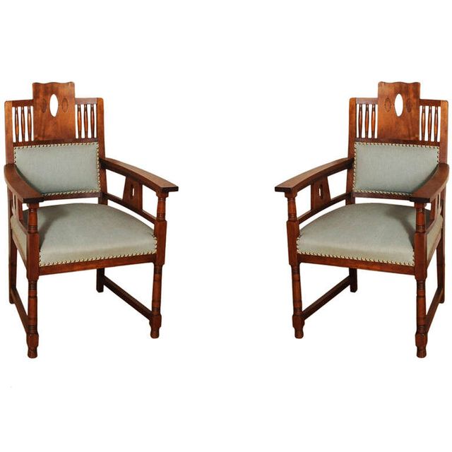 A Dutch Art Deco mahogany dining room set of a table and four chairs, circa 1920
