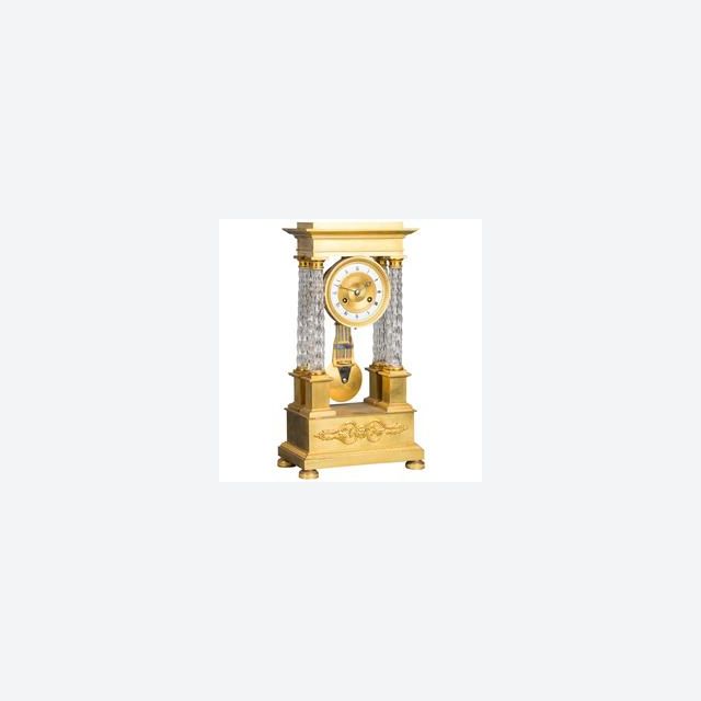 An attractive Charles X ormolu and crystal portico striking 8-day mantel clock