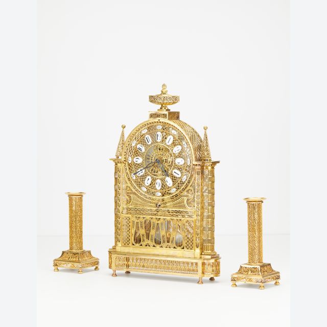 An unusual French Louis XVI filigree skeleton clock set, circa 1780