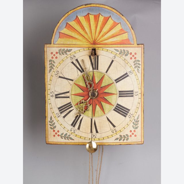 A German Wall Clock with ‘cow’s-tail pendulum’ and wooden wheels circa 1800