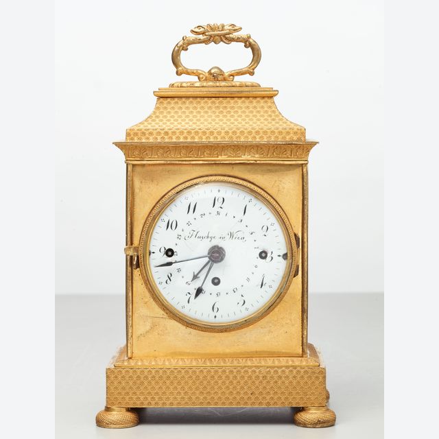 A small Vienna bronze gilt travelling clock by Tobias Flaschge, circa 1810