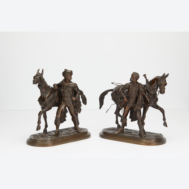 Pair or bronzes of horses with rider