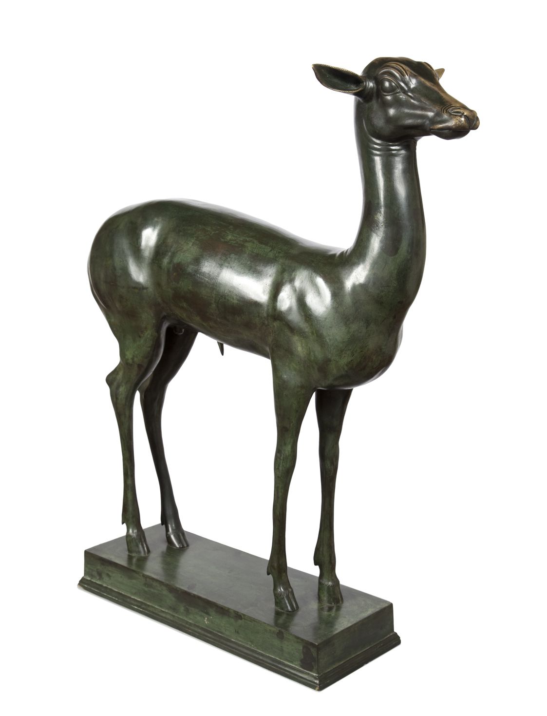 An elegant bronze sculpture of a fawn