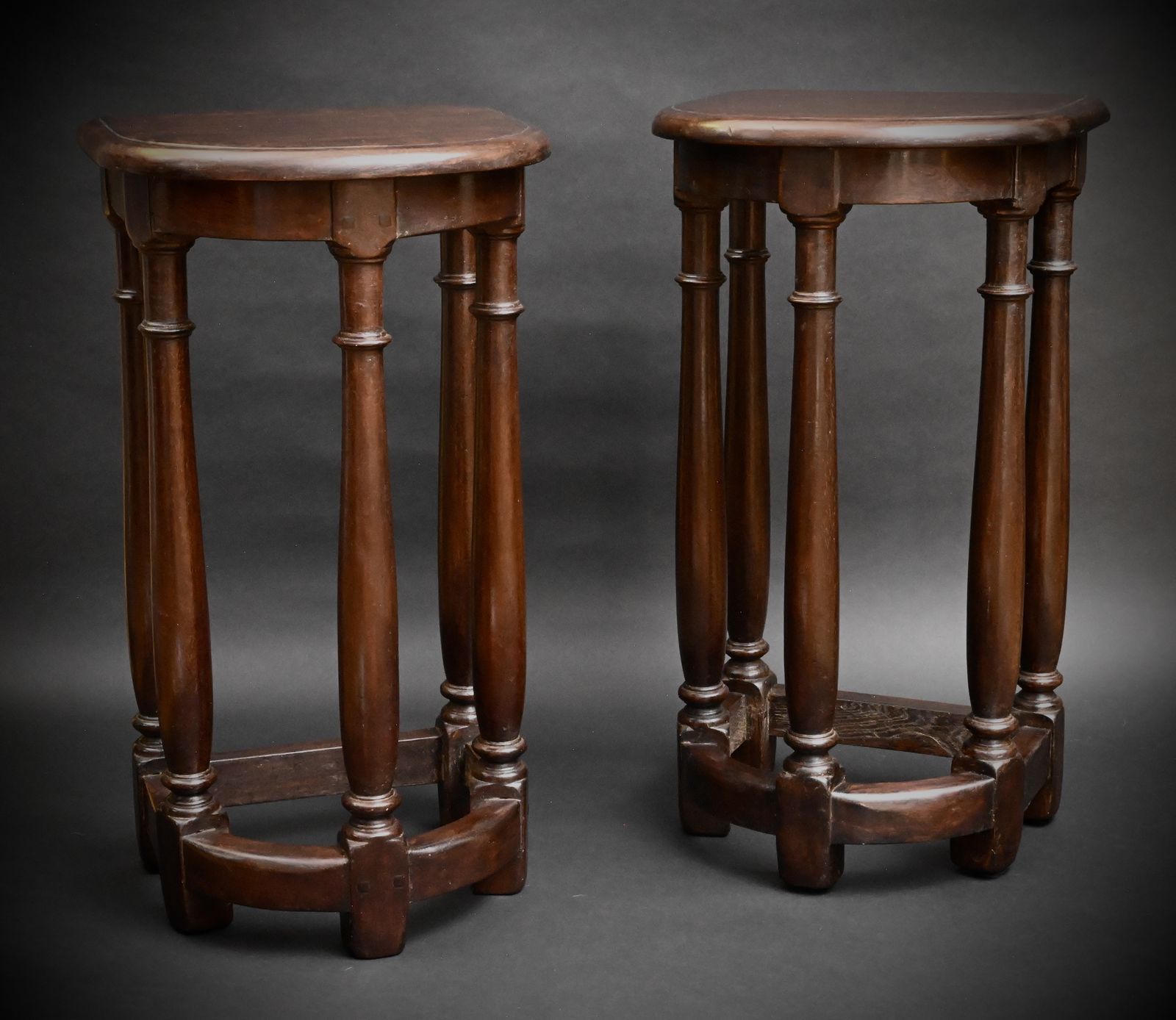 A pair of decorative oak stools