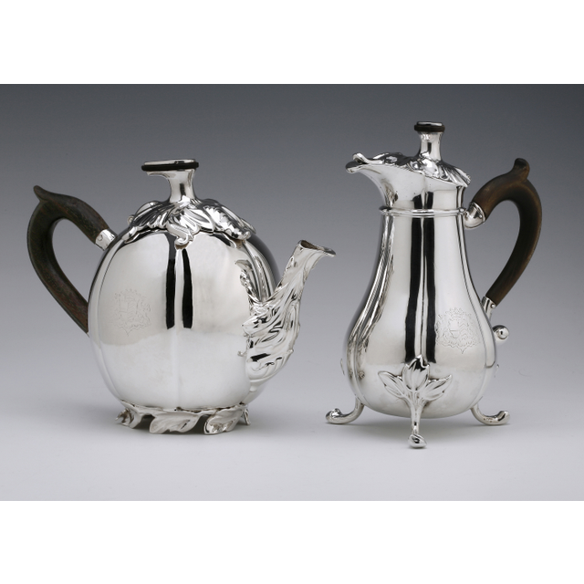 An antique Dutch silver teapot and milk jug