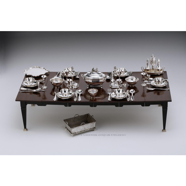 A miniature table set for six with antique Dutch silver miniature silver
