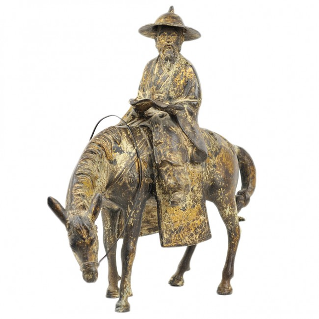 A CHINESE GILT-BRONZE SCULPTURE OF A SCHOLAR RIDING A HORSE