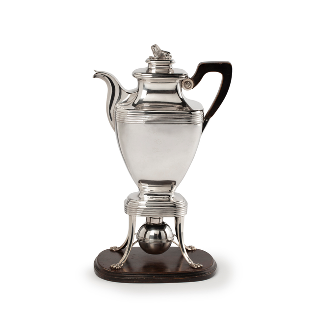 Silver coffee pot on chafing dish