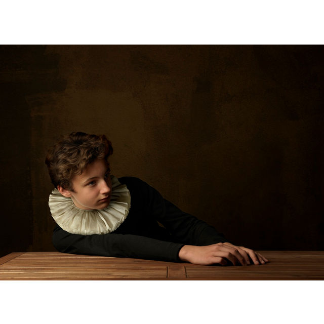 Boy with White Collar at Table