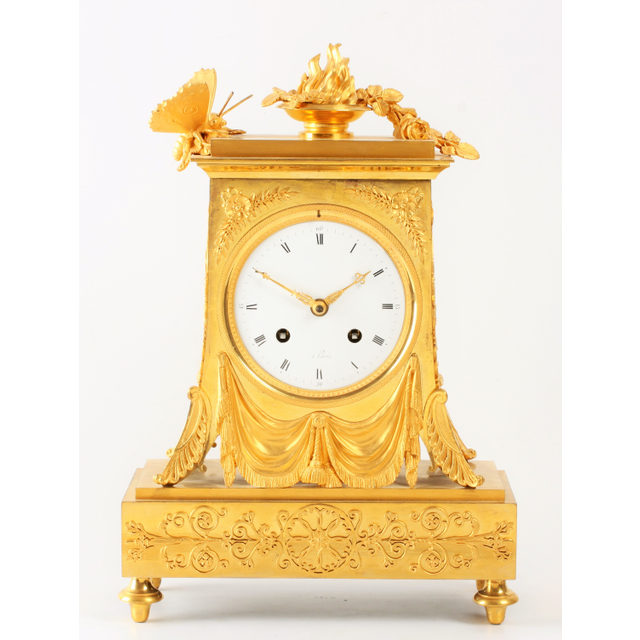A lovely French Empire ormolu borne mantel clock with butterfly, circa 1800
