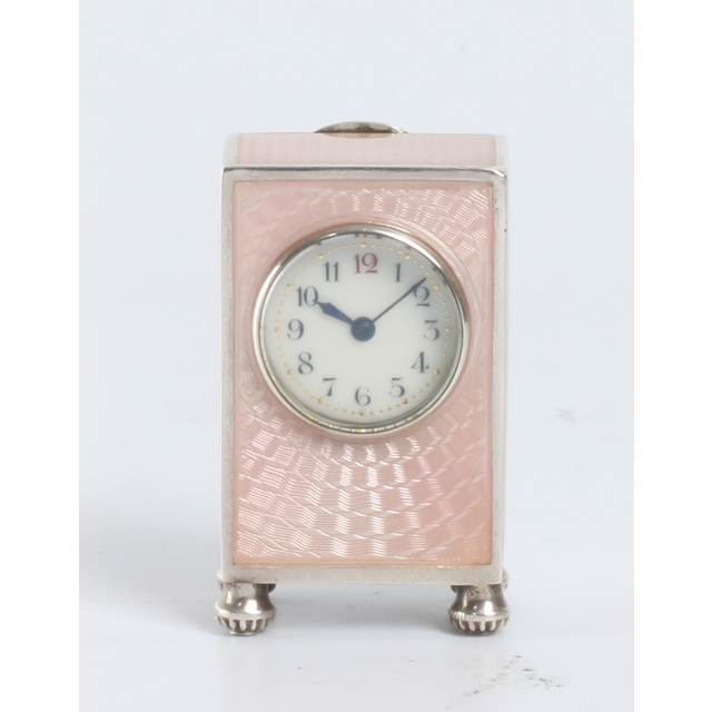 A miniature Swiss silver pink translucent guilloche enamel timepiece, circa 1900.