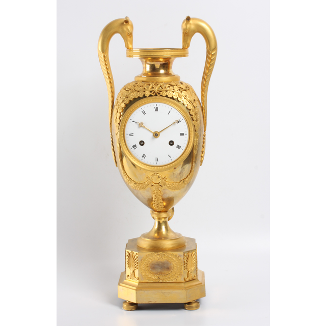 A large French Empire ormolu urn mantel clock with mythical animals, circa 1800