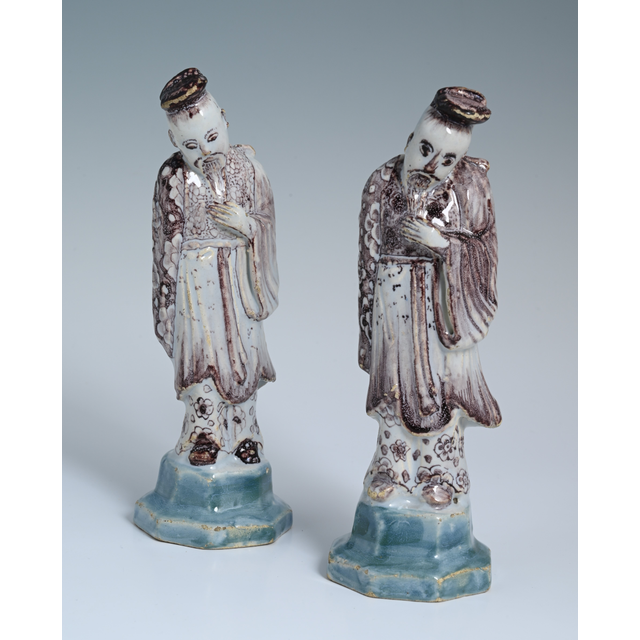 A pair of Delftware chinoiserie sculptures