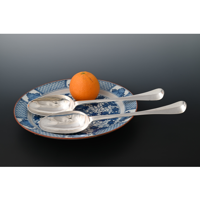 Two large silver serving spoons