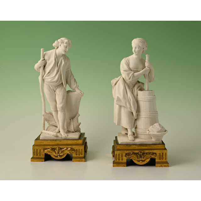 A set of two decorative biscuit-porcelain figures