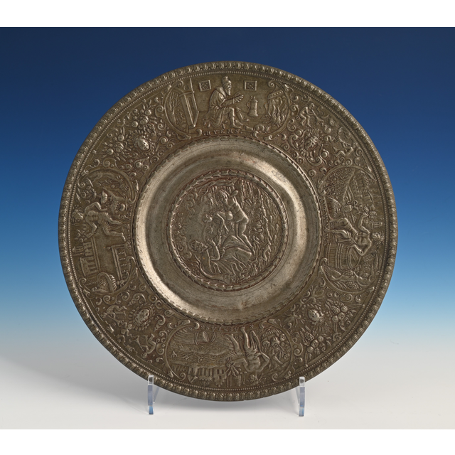 A pewter relief plate