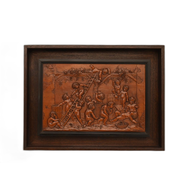 A finely carved palm-wood relief