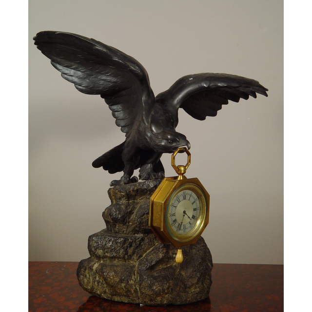 An eagle shaped bronze watch stand and clock watch with quarter repetition