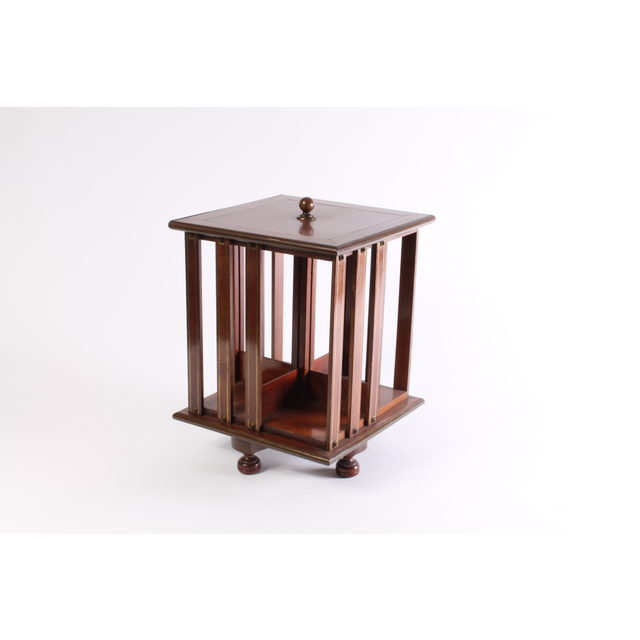 A small English brass inlaid mahogany revolving bookcase, circa 1880.