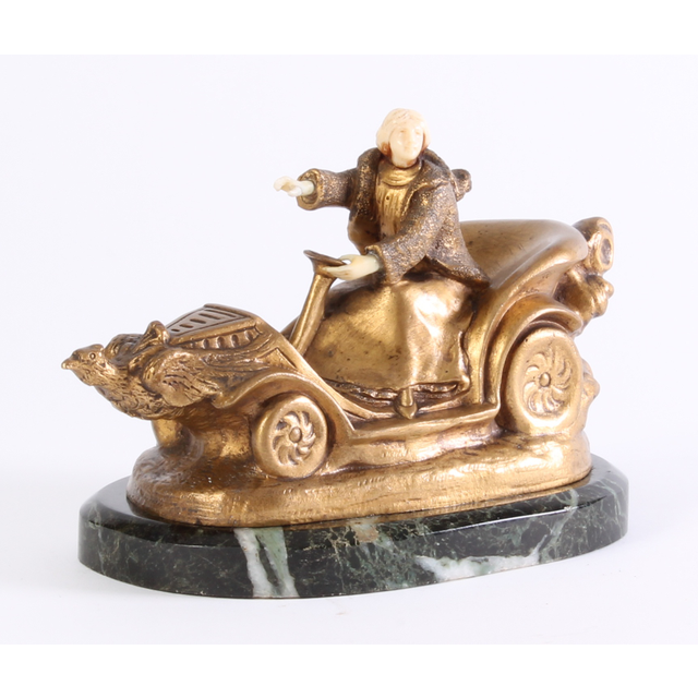 An Art Deco bronze marble and ivory sculpture of a car, circa 1920.