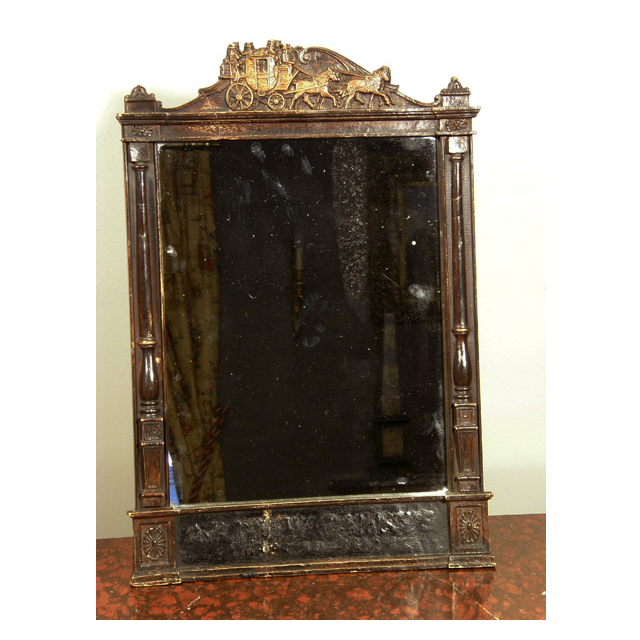 A mirror fitted in a former wooden time table frame, probably USA, ca 1880.
