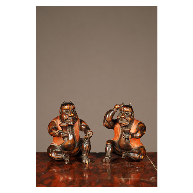 A set of two probably Japanese carved boxwood 'satyr' figures, circa 1880.