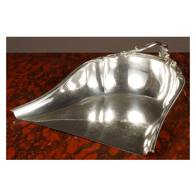 Silver dustpan with a beautifully decorated handle, circa 1880.