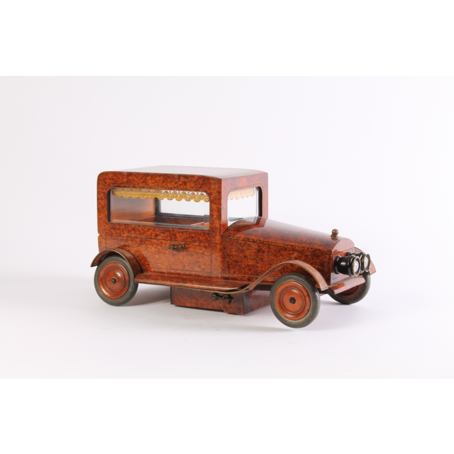 An Art Deco thuja burr model of a car with music box, circa 1930